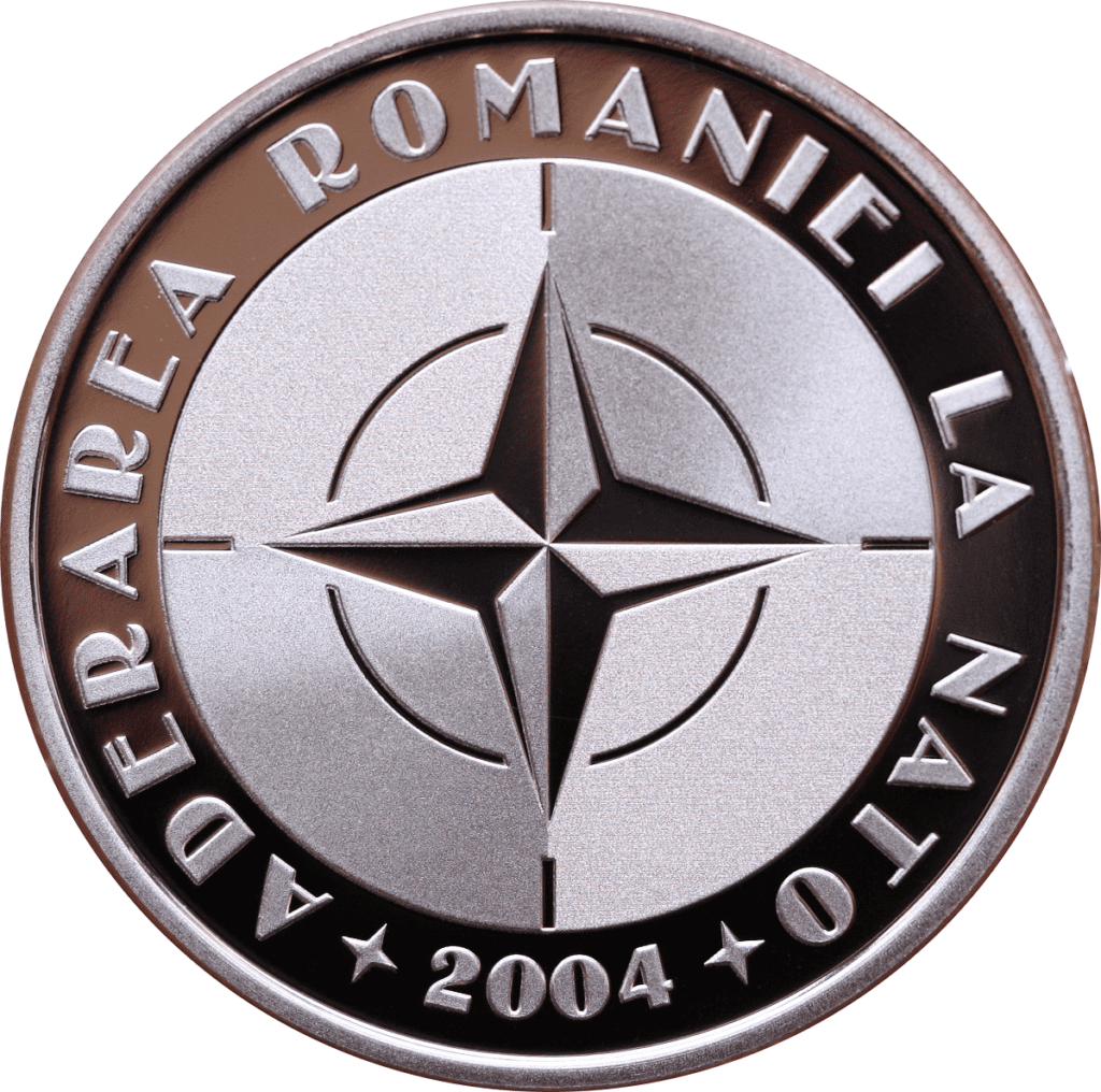 Din 29 aprilie 2024, Banca Națională a României (BNR) a lansat în circuitul numismatic o monedă din argint și o monedă din tombac cuprat cu tema 20 de ani de la aderarea României la NATO.
